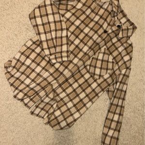 Brownish or creamyish shirt